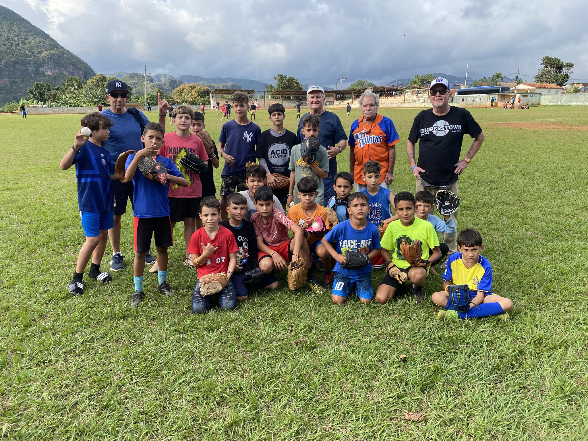 Cuban Youth on a baseball field with glove donations.